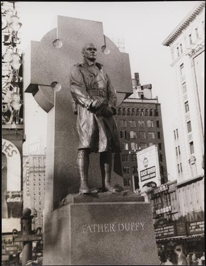 Carl Van Vechten (1880-1964). Statue of Father Duffy, Times Square, May 15, 1937. Museum of the City of New York. X2010.8.566 Image used with permission from the Van Vechten Trust.