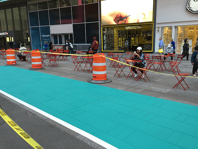 Photo of a teal painted rectangle on the plazas of Times Square